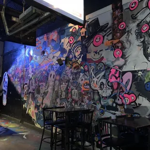 a wall covered in graffiti