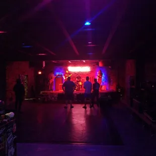 a group of people in a dark room