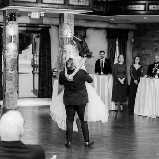 a bride and groom having their first dance