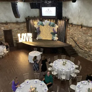 a stage with a stage set up for a wedding reception