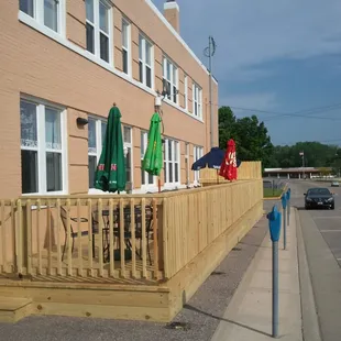 a row of tables and umbrellas