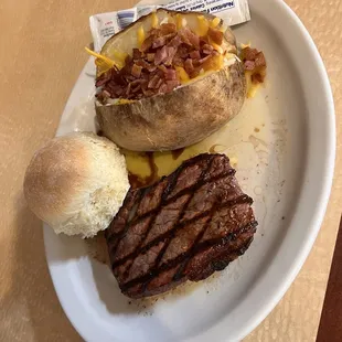 Medium rare sirloin with loaded baked potato