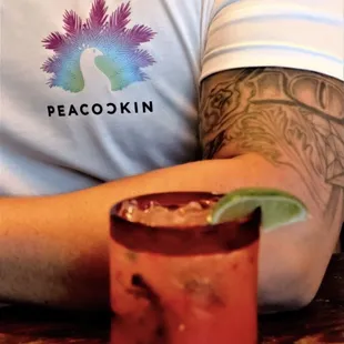 a man holding a drink