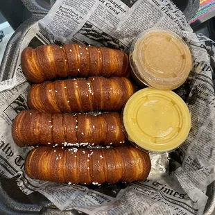 a basket of pretzels and mustard