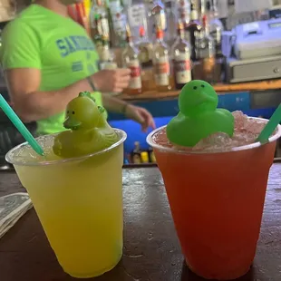 two cups of drink and a rubber duck