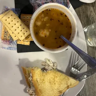 a bowl of soup and crackers
