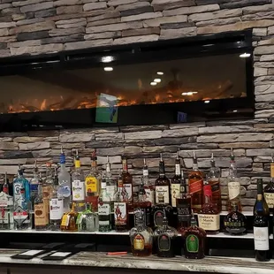 Nice gas fireplace above the full bar.