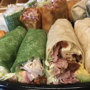 a variety of sandwiches on a plate