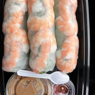 Shrimp spring rolls...DELICIOUS peanut sauce (well balanced). Add the pepper sauce &amp; it's perfect. Love the tiny spoons!!!