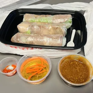 Pork spring rolls with dipping sauces.