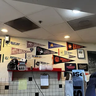 a variety of pennants on the wall