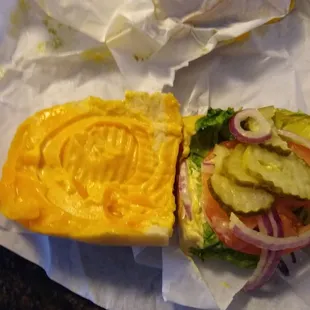 This is the COLD Cheese sandwich. The MELTED cheese is on the left, it's not mustard.