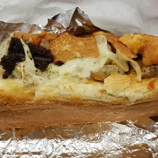 #23 from The Sandwich spot. Gross black burnt stuff stuck to sandwich. Soggy bread.