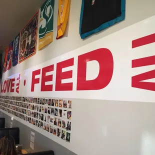 Photo wall and business motto.