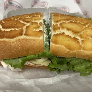 Turkey and Swiss cheese with lettuce, tomatoes,  pickles and mayo.