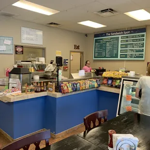 a woman standing at the counter