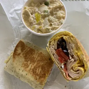 Pressed turkey &amp; Swiss on a spinach wrap w/ a side of potato salad-- excellent &amp; approximately $7. BEST wrap I&apos;ve ever eaten:)