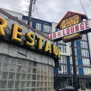 Vintage signs with new development behind.
