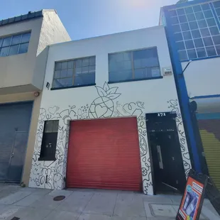 Front of the building. Red garage door = Sarap!