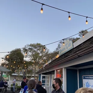 a group of people outside a restaurant
