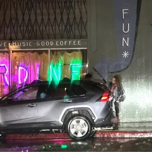 a car parked in front of a coffee shop