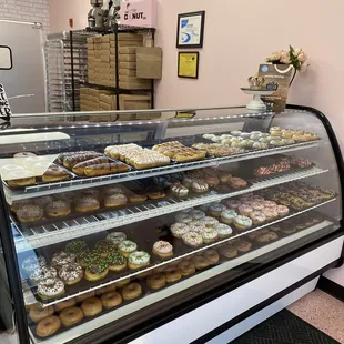 a display case filled with donuts