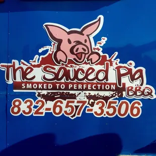 a blue truck with a pig on it