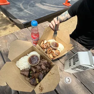 a man sitting at a picnic table