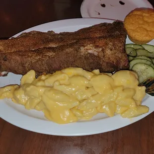 Half rack of ribs, mac and cheese, corn muffin, and pickles