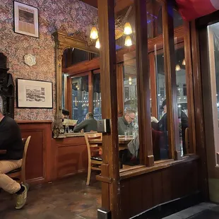 a man sitting at a table in a restaurant