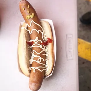 a hot dog with ketchup and mustard