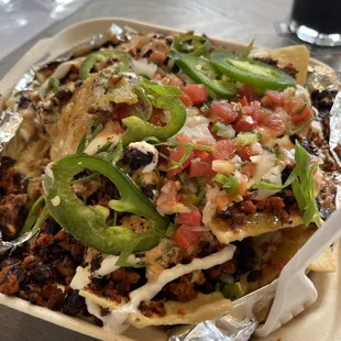 Loaded Nachos!  Cashew cheeze, soyrizo, and other goodies, oh yum!  Who knew vegan food could be so delicious?!?!