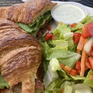 BLTA croissant with salad and house herb dressing.