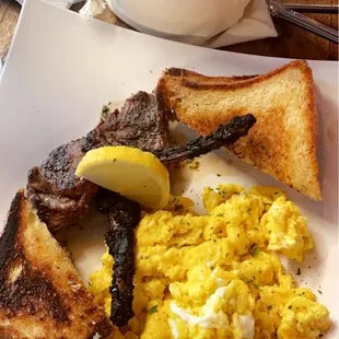 Lamb chops, eggs and toast