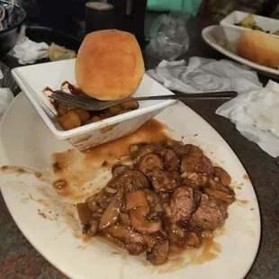 Beef Tips with gravy and grilled onions and mushrooms, wild rice, fried okra.