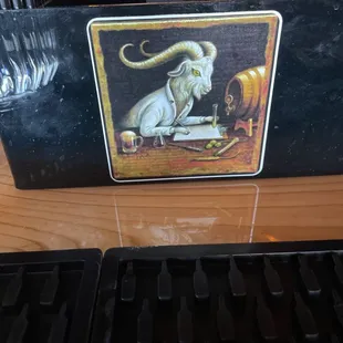 a goat sitting at a desk