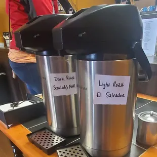 a coffee maker and a cup of coffee