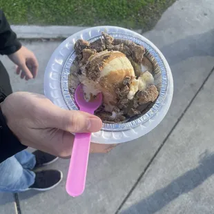 a person holding a plate of food