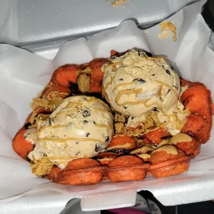 Red Bubble Waffle with honey roasted peanut butter ice cream and peanut butter drizzle
