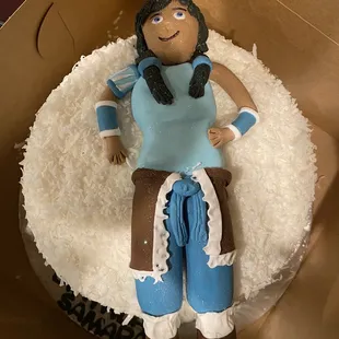 THIS is what we got..  the character is LARGER THAN THE CAKE. NOT opened like an Angel. looks like a cake for a baby. $215 for this?!