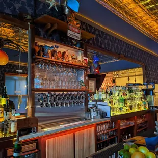 a bar filled with bottles of alcohol