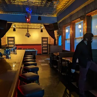 a man standing at the bar