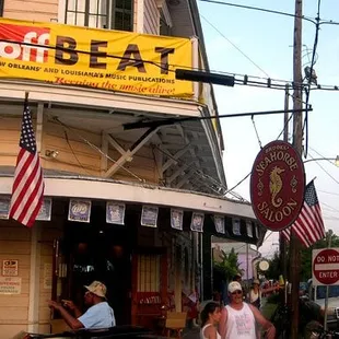 people walking in front of the restaurant
