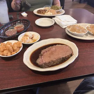 Fried shrimp, broiled scallops, 12 oz. Prime rib, rice and mashed potatoes.