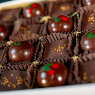 Dairy free and vegan friendly, candied cherry wrapped in coconut milk caramel. and coconut milk and 60% dark chocolate truffles.