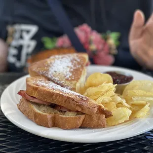 Monte Cristo Sandwich, kettled cooked potato chips, and raspberry sauce.