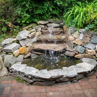 Pretty waterfall in the outdoor patio seating area.