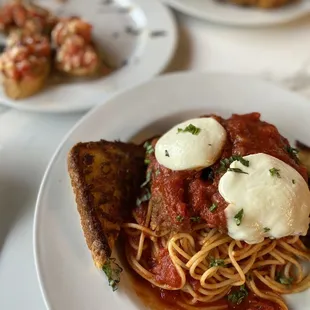 Top to bottom: Egg and avocado croissant (Half eaten) Bruschetta Chicken parmesan