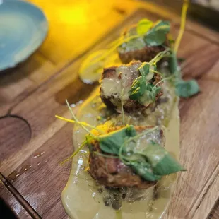 Pork Trio- It is three types of pork fried in a crispy crust on a bed of coconut spaghetti squash with lentils. Delicious!