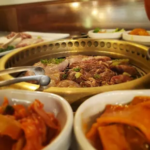 several bowls of food on a table